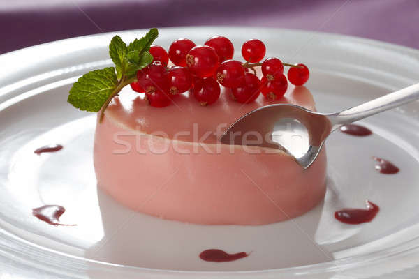 Creamy vanilla pannacotta with red currant flavouring Stock photo © belahoche