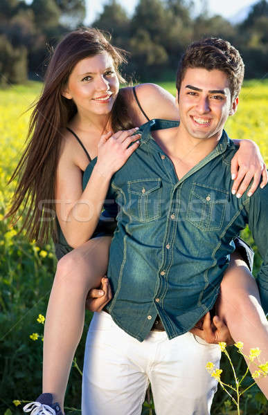 Playful affectionate young couple Stock photo © belahoche