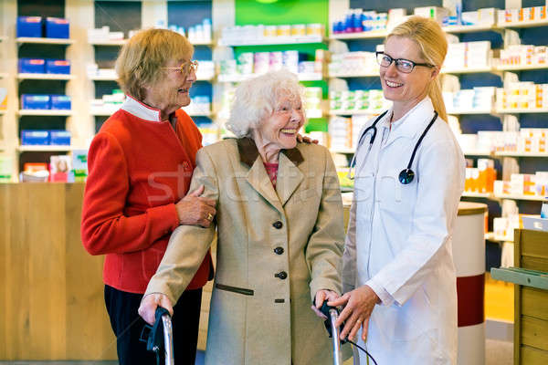 Laughing patients with happy doctor Stock photo © belahoche