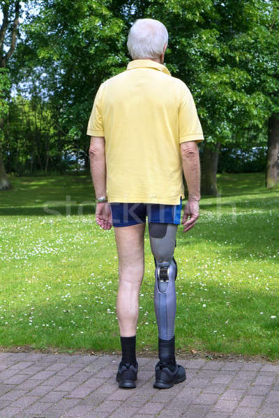 Rear view on man with prosthetic leg Stock photo © belahoche