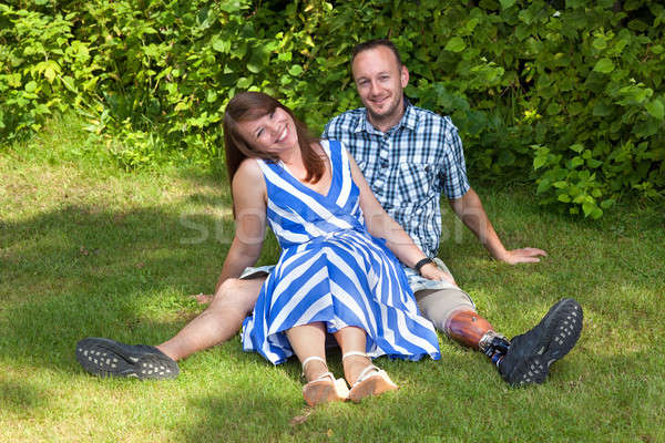 Happy attractive couple relaxing in the garden Stock photo © belahoche