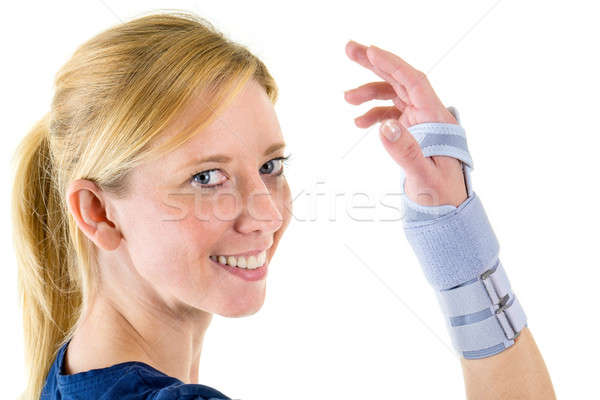 Smiling Blond Woman Wearing Supportive Wrist Brace Stock photo © belahoche