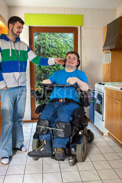 Young cerebral palsy patient listening to music Stock photo © belahoche