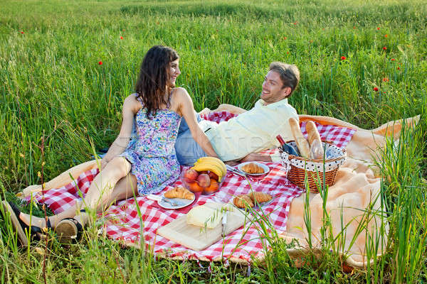 Stock photo: Relaxed young couple enjoying a summer picnic