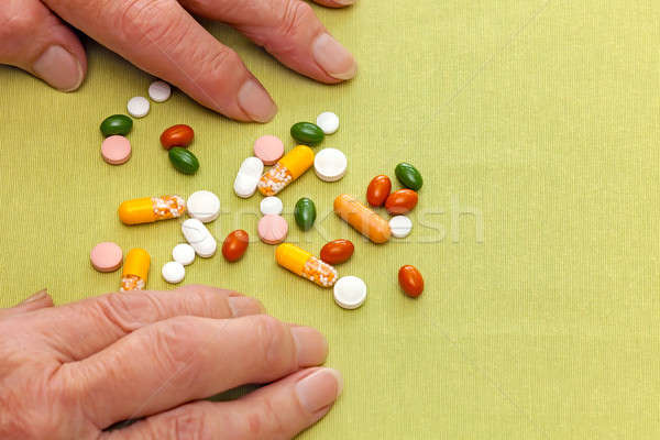 Old woman confused by her medication Stock photo © belahoche