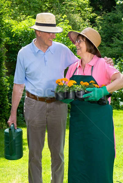 Happy Senior Couple in Garden Gazing at Each Other Stock photo © belahoche