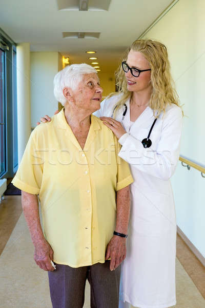 Nurse Talking to an Elderly Woman at the Corridor Stock photo © belahoche
