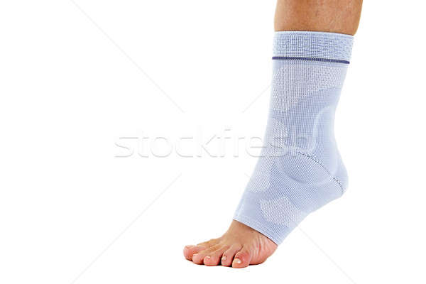 Stock photo: Woman Wearing Flexible Elastic Ankle Brace