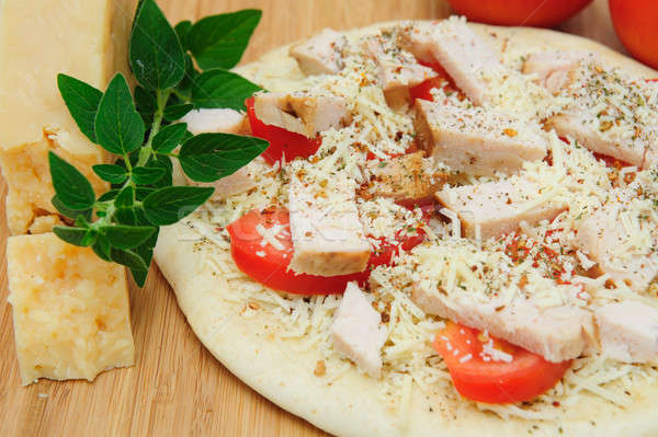 Un-cooked Chicken And Asiago Cheese Pizza Stock photo © bendicks