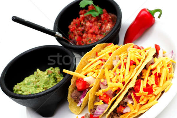Kabuk tacos üç taze salsa hizmet Stok fotoğraf © bendicks