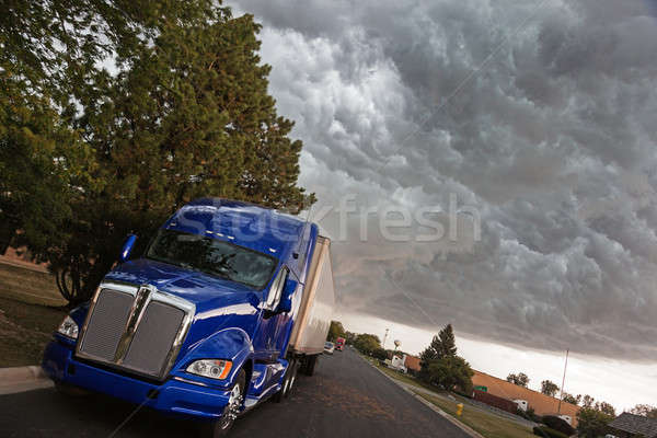 Semi Truck under heavy clouds Stock photo © benkrut