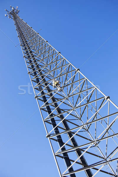 Climber ascending the cellular tower Stock photo © benkrut