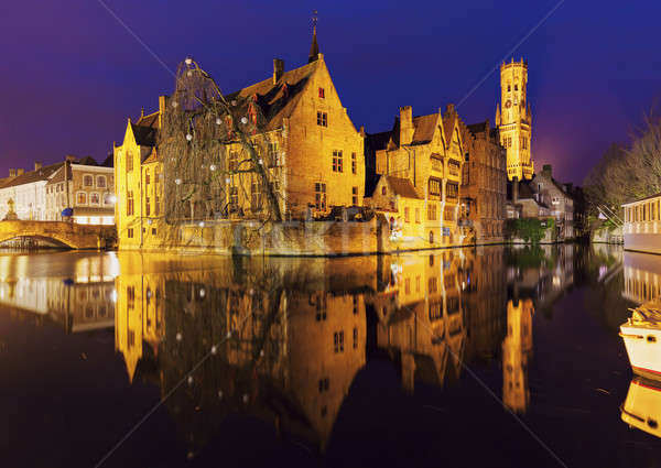 Belfry of Bruges reflected in the canal Stock photo © benkrut