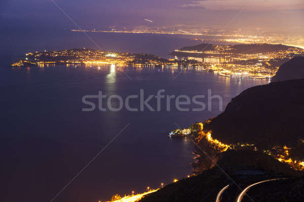 Distant view of Saint Jean Cap Ferrat and Nice at sunset Stock photo © benkrut
