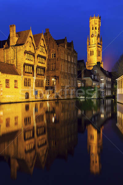 Belfry of Bruges reflected in the canal Stock photo © benkrut