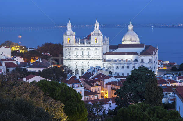 Mosteiro casa cidade pôr do sol igreja linha do horizonte Foto stock © benkrut