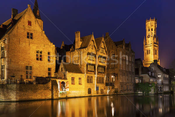 Belfry of Bruges reflected in the canal Stock photo © benkrut