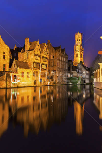 Belfry of Bruges reflected in the canal Stock photo © benkrut