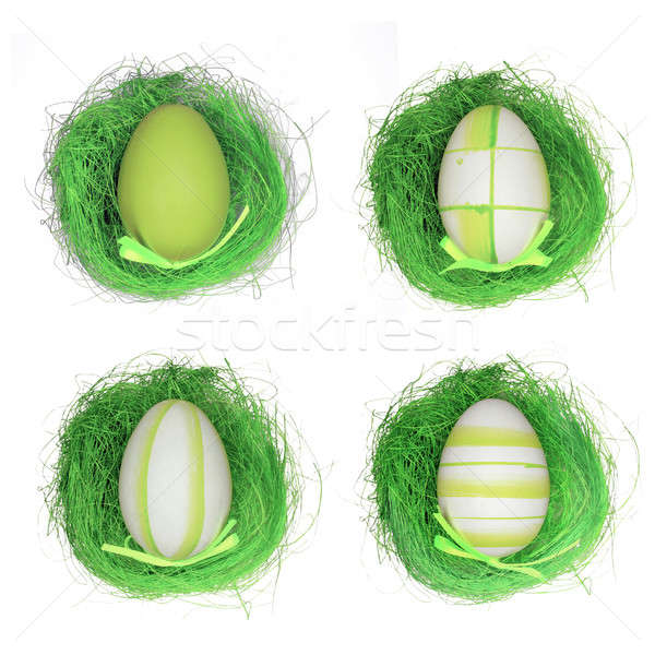 Quatro ovos de páscoa grama grama artificial isolado branco Foto stock © berczy04