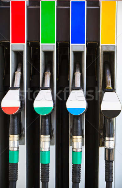 Gasoline pump nozzles at petrol station  Stock photo © Bertl123