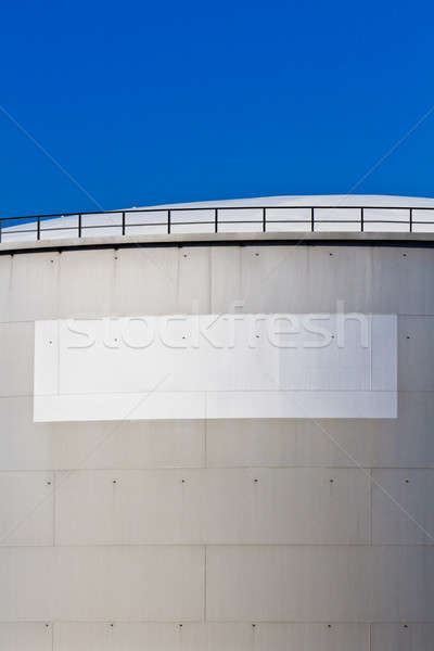 Oil reservoir on a petrochemical plant with white label Stock photo © Bertl123