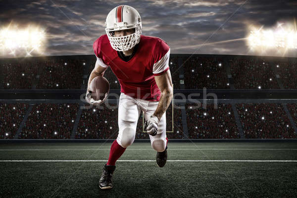 Voetballer Rood uniform lopen stadion sport Stockfoto © betochagas