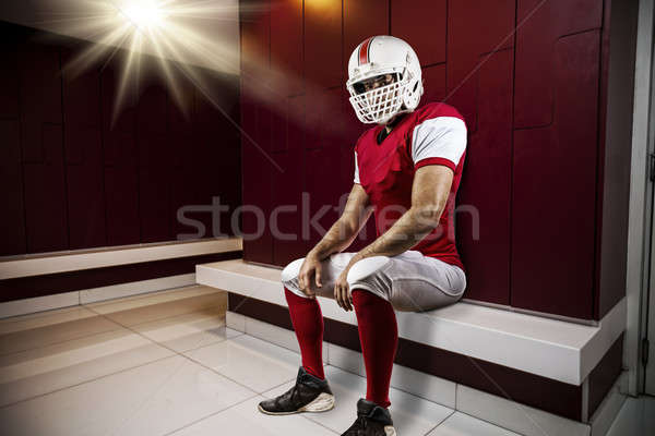 Rouge uniforme assis vestiaire yeux Photo stock © betochagas