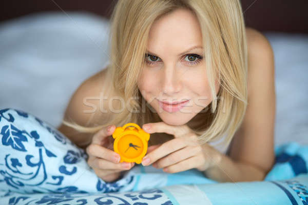 Woman with clock Stock photo © bezikus