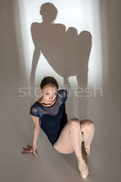 Full-length portrait sitting on the floor of a graceful ballerin Stock photo © bezikus