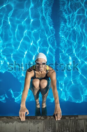 Blonde girl in pool Stock photo © bezikus