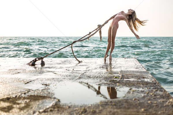 Ballerina posing on seafront Stock photo © bezikus