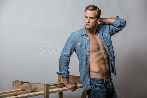 Man in unbuttoned shirt Stock photo © bezikus