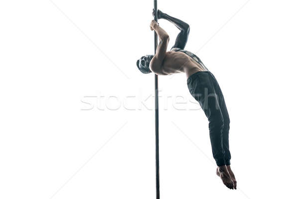 Male pole dancer with body-art on pylon Stock photo © bezikus