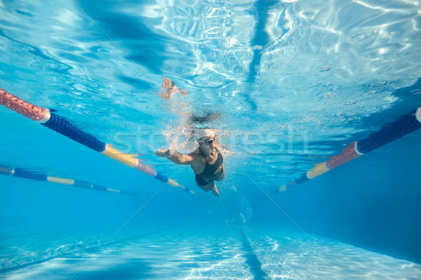 Mulher subaquático movimento foto menina nadar Foto stock © bezikus
