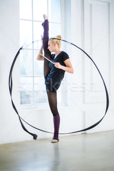 Doing exercises with a ribbon. Stock photo © bezikus