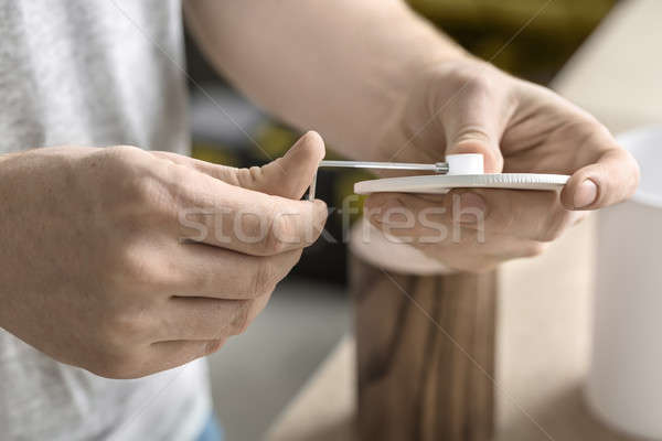 Man using wrench in workshop Stock photo © bezikus