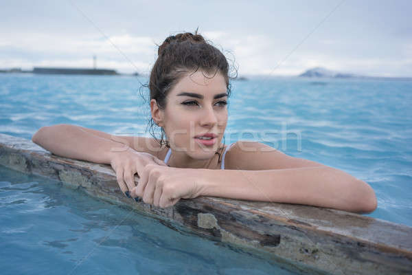 Stock photo: Girl relaxing in geothermal pool outdoors