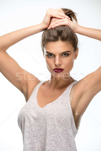 Lány fehér stúdió póló kezek tart Stock fotó © bezikus