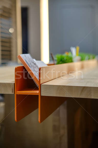 Stehen Bürobedarf orange Buch Notebook grünen Gras Stock foto © bezikus