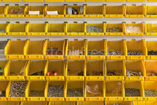 Plastic yellow boxes with instruments on wall  Stock photo © bezikus