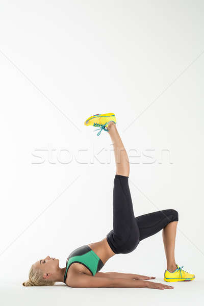 Rhythmic gymnast doing exercise in studio. Stock photo © bezikus