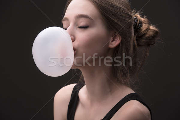 Sexual brown-haired girl with bubble of chewing gum Stock photo © bezikus