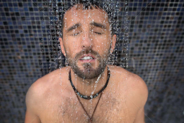 Man in shower Stock photo © bezikus