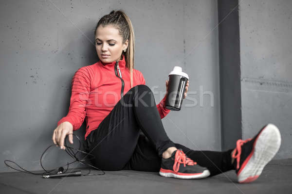 Sportive girl relaxing in gym Stock photo © bezikus
