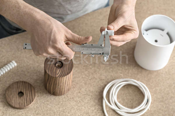 Man using caliper in workshop Stock photo © bezikus