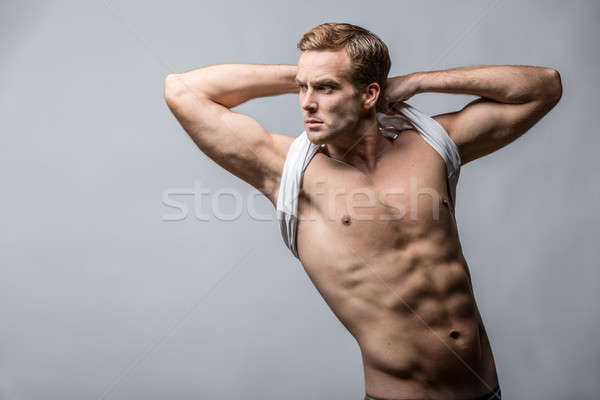 Muscular man in studio  Stock photo © bezikus