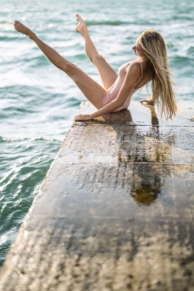 Ballerina posing on seafront Stock photo © bezikus