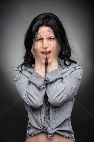 Multi exposure portrait of emotional brunette. Stock photo © bezikus