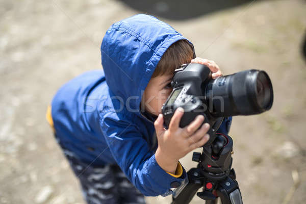 Kid with photo camera Stock photo © bezikus