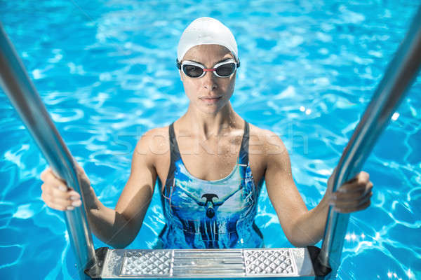Sportive girl in the swim pool Stock photo © bezikus
